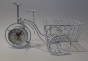 Wrought-iron cloks or flowerpot holder